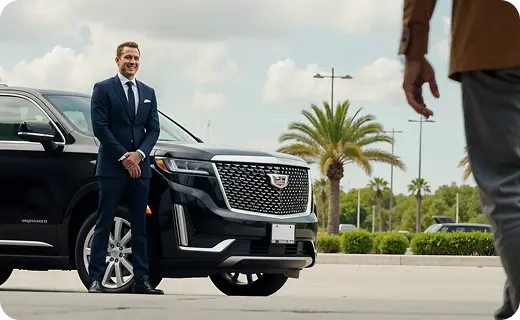 Chauffeur Waiting for family at Florida airport  for an SUV transfer